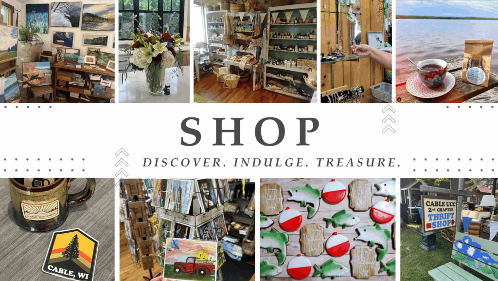 A promotional collage showcasing a variety of shopping experiences in Cable, Wisconsin. The central text reads "SHOP" with the tagline "DISCOVER. INDULGE. TREASURE." Surrounding it are eight images: a room filled with artwork and paintings, a vase with a bouquet of flowers, shelves stocked with baskets and jars, a person holding jewelry, a cup of tea and packaged cookies on a wooden surface near a lake, a ceramic mug labeled "Cable Wisconsin" next to a local-themed sticker, a rack displaying greeting cards, and decorated cookies shaped like fish and bobbers. The collage evokes the charm of local shopping, emphasizing unique finds and treasured goods.